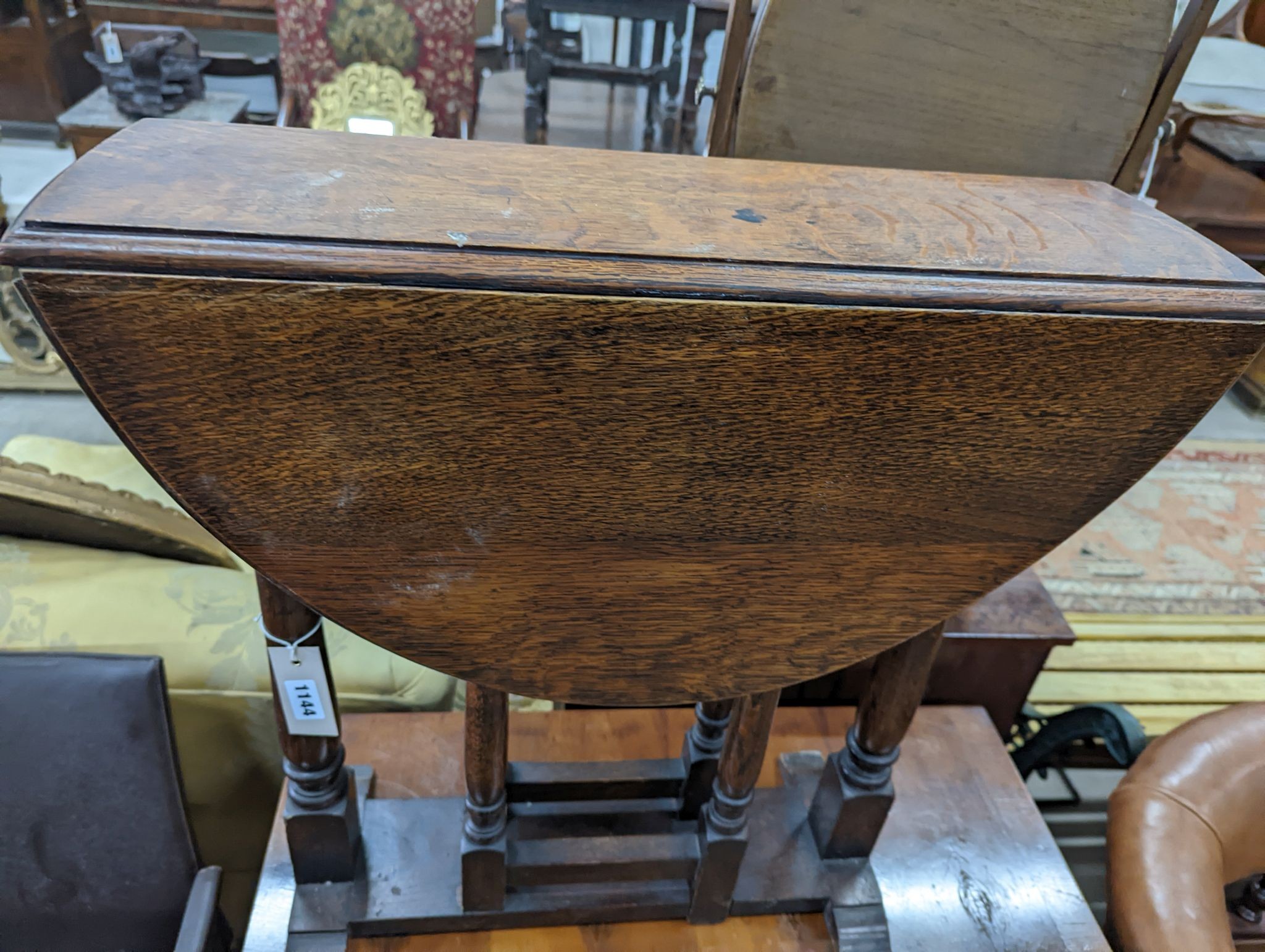 An 18th century style oak drop flap occasional table, width 60cm, height 62cm